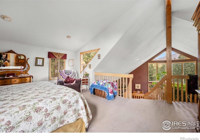 carpeted bedroom with beam ceiling and high vaulted ceiling