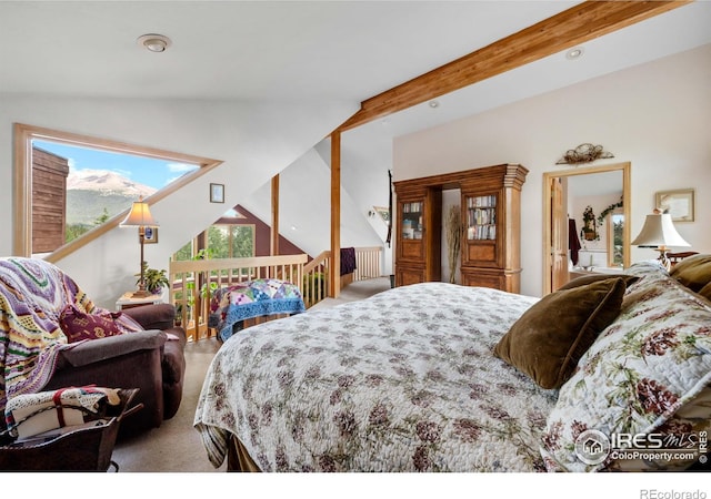 carpeted bedroom featuring lofted ceiling with beams