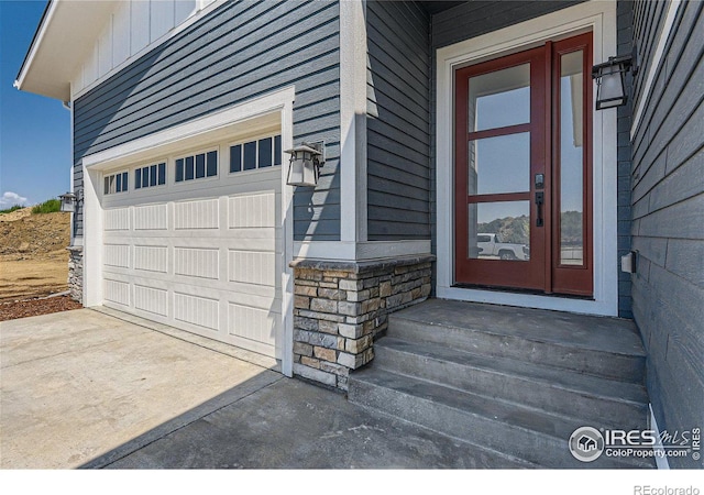 doorway to property featuring a garage