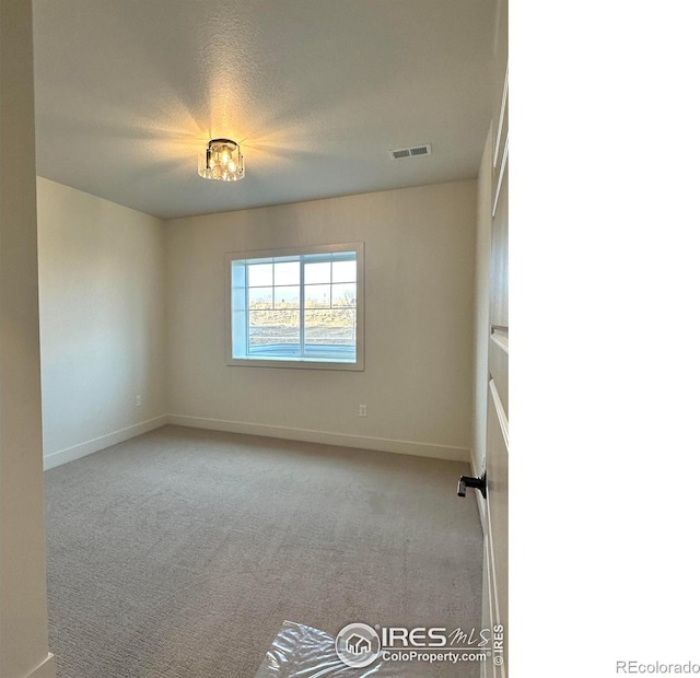 view of carpeted spare room