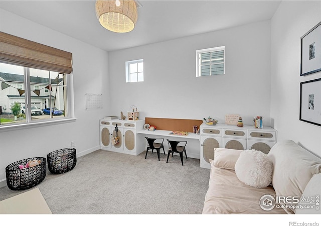 interior space with washing machine and dryer and light carpet