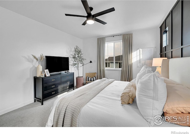 bedroom with ceiling fan and light colored carpet