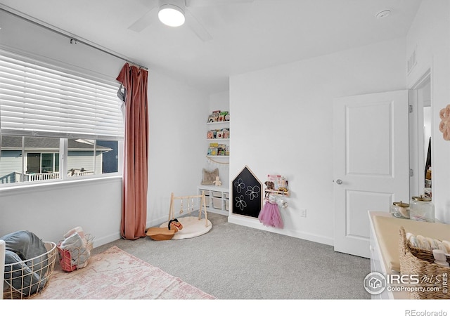 game room with carpet floors and ceiling fan