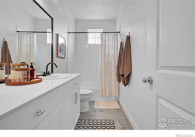 full bathroom featuring vanity, shower / tub combo, and toilet