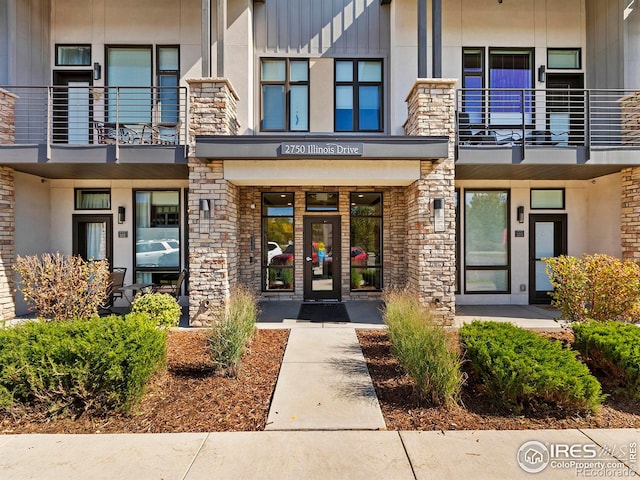 entrance to property featuring french doors and a balcony