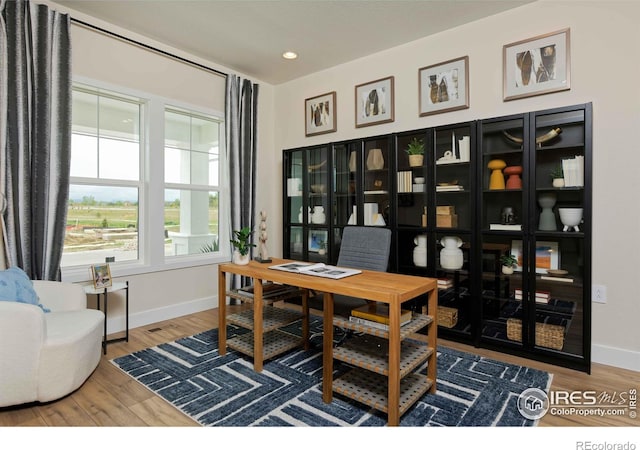 office area with hardwood / wood-style floors