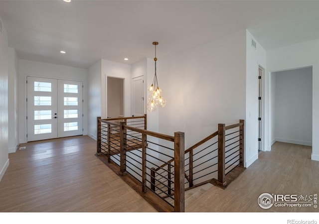 entrance foyer featuring french doors and hardwood / wood-style flooring