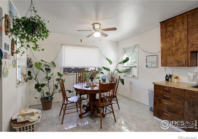 dining space featuring ceiling fan and cooling unit