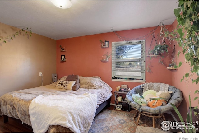 bedroom featuring wood-type flooring