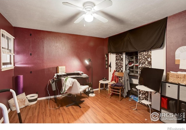 interior space featuring hardwood / wood-style floors and ceiling fan