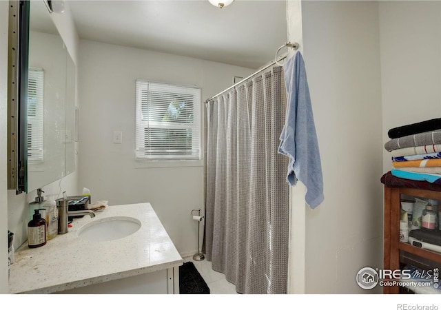 bathroom with vanity and tile patterned floors