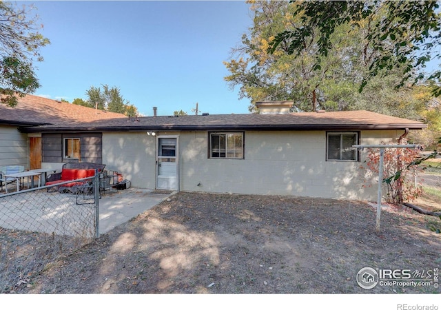 rear view of property with a patio area