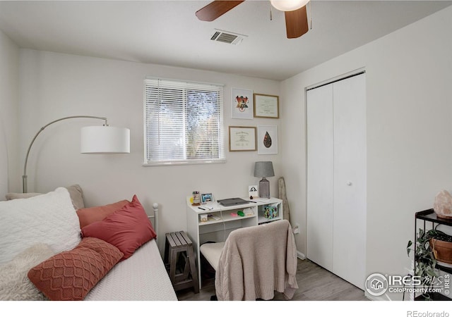 office space featuring ceiling fan and light hardwood / wood-style flooring