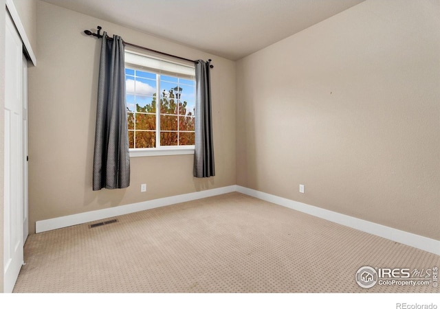 view of carpeted spare room