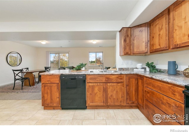 kitchen featuring light tile patterned floors, black appliances, sink, and kitchen peninsula