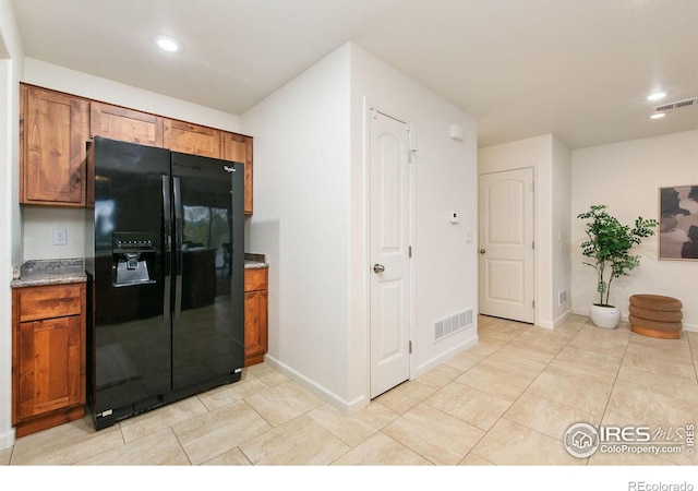 kitchen with black fridge