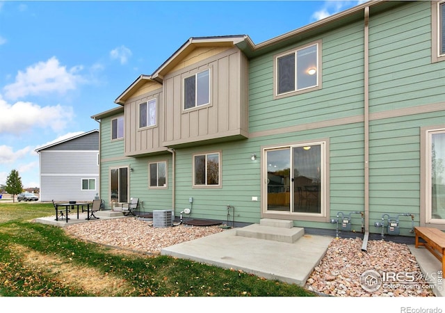 rear view of property featuring a patio area and central AC unit