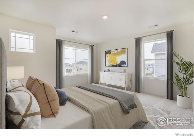 carpeted bedroom featuring multiple windows