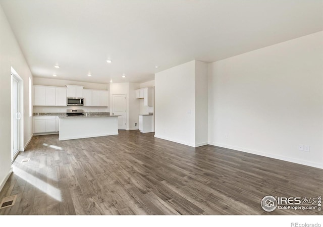 unfurnished living room featuring hardwood / wood-style floors