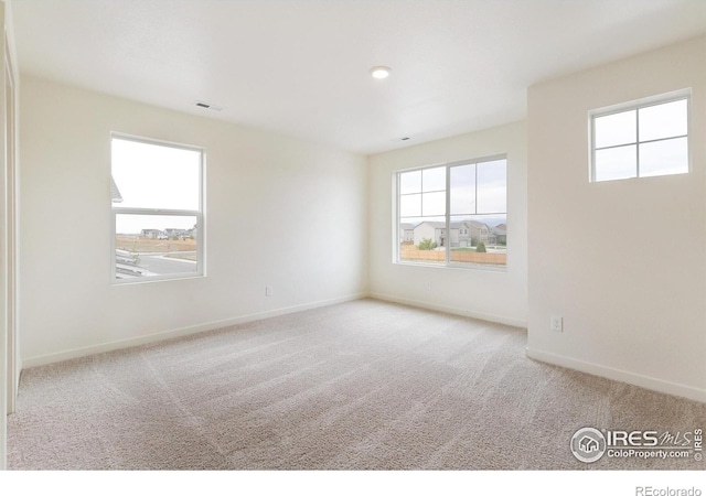 view of carpeted spare room