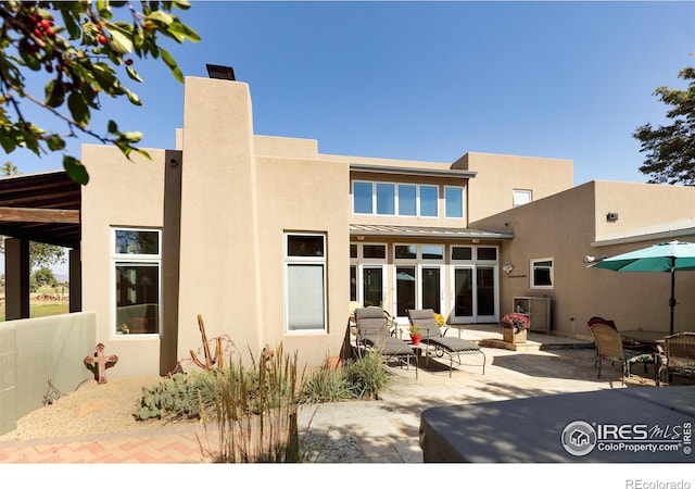 rear view of house with a patio area