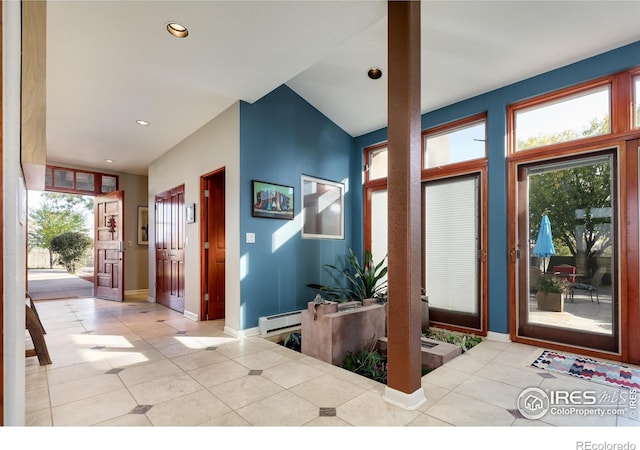 entryway with a baseboard radiator and light tile patterned floors