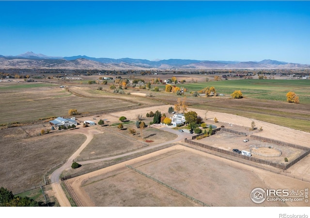 birds eye view of property featuring a mountain view and a rural view