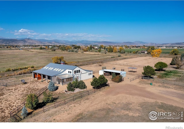 birds eye view of property featuring a rural view and a mountain view