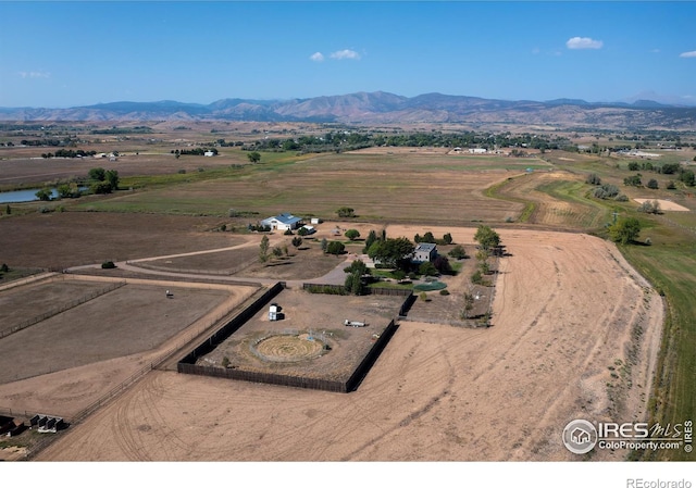 birds eye view of property with a mountain view and a rural view