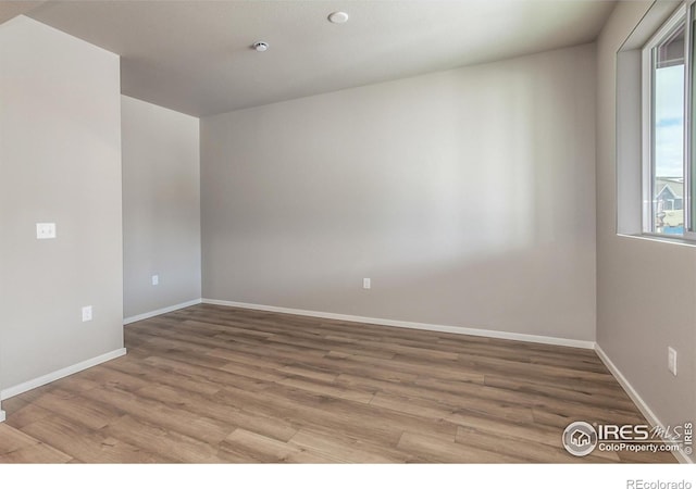 spare room with light wood-type flooring