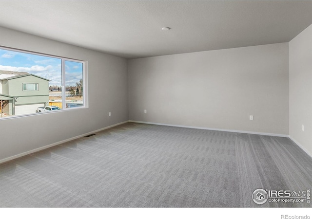 view of carpeted spare room