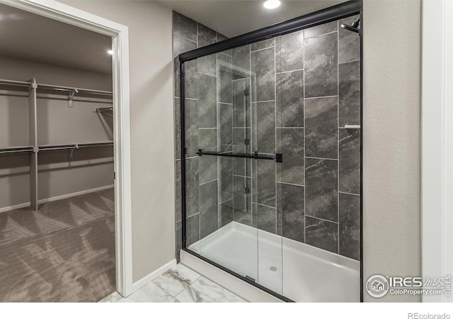 bathroom featuring an enclosed shower