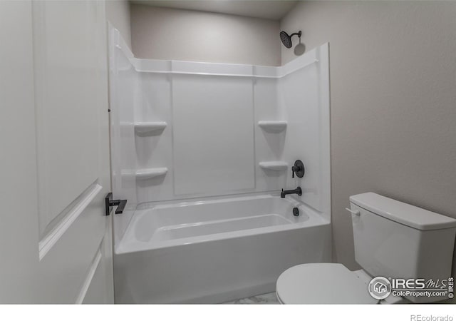 bathroom with toilet and tub / shower combination