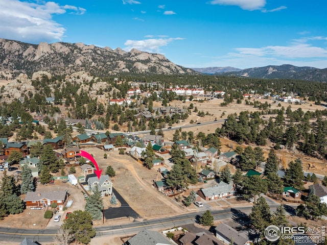 drone / aerial view featuring a mountain view