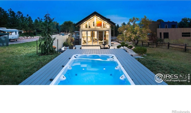 view of swimming pool with a patio area and a lawn