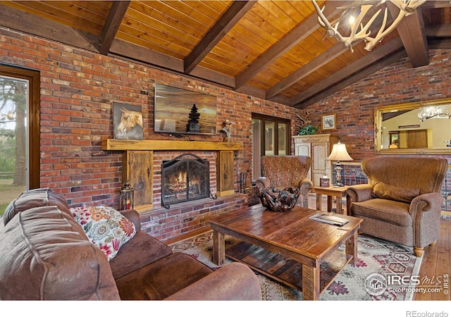 living room featuring hardwood / wood-style flooring, wooden ceiling, a brick fireplace, lofted ceiling with beams, and brick wall