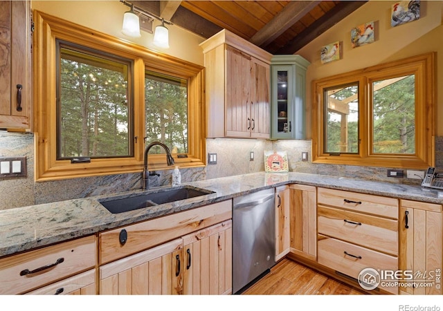 kitchen featuring light stone countertops, sink, wood ceiling, lofted ceiling with beams, and stainless steel dishwasher