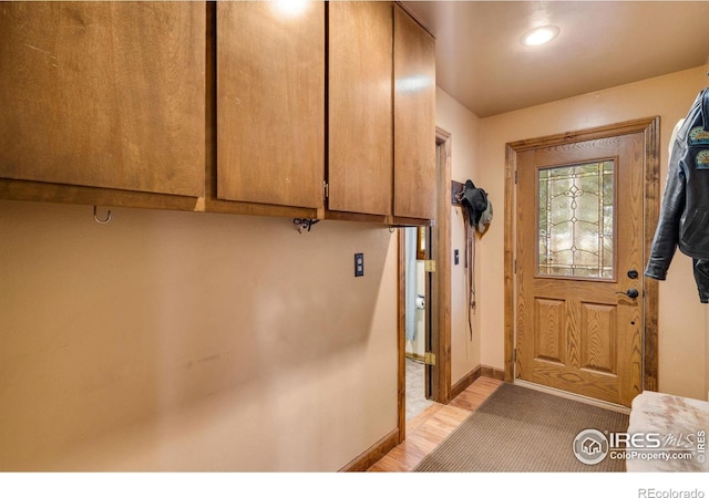 doorway to outside with light hardwood / wood-style flooring