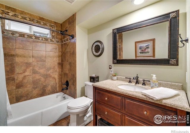 full bathroom featuring shower / bath combo with shower curtain, toilet, vanity, and tile patterned flooring