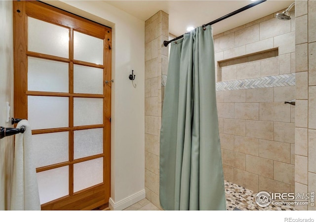 bathroom featuring tile patterned floors and walk in shower