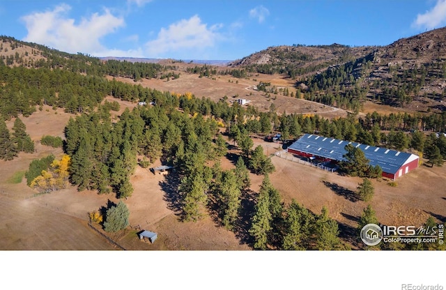 birds eye view of property with a mountain view