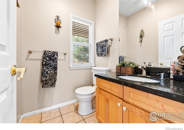 bathroom featuring vanity, toilet, and tile patterned floors