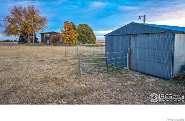 view of outdoor structure with a yard