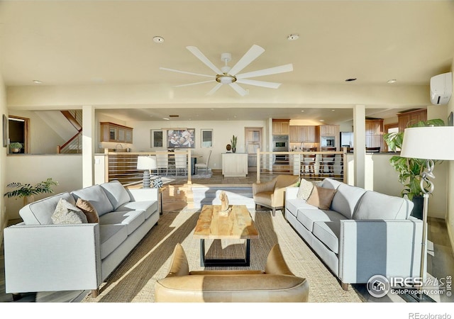 living room featuring ceiling fan and a wall mounted air conditioner