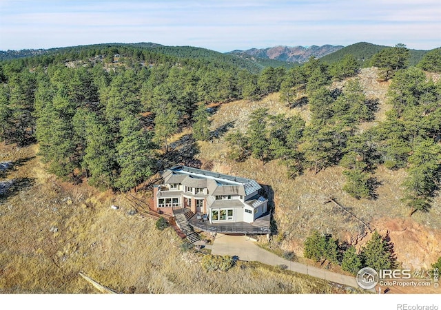 birds eye view of property with a mountain view