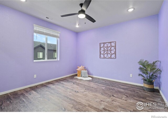 unfurnished room featuring hardwood / wood-style floors and ceiling fan