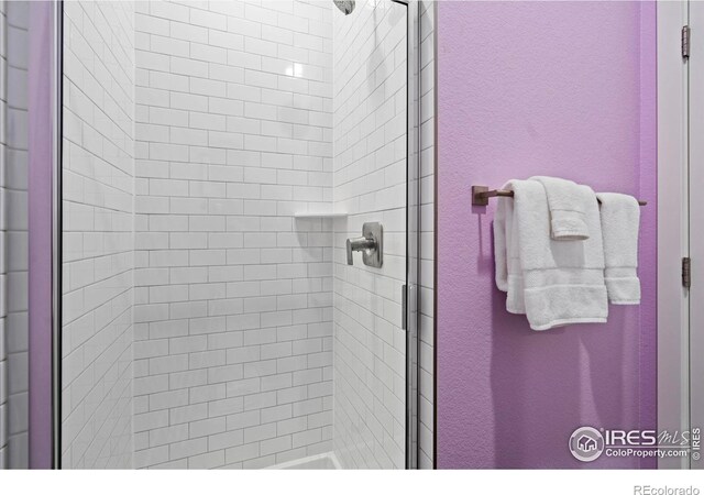 bathroom featuring an enclosed shower