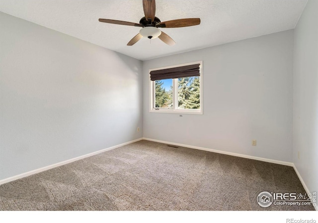 carpeted empty room with ceiling fan