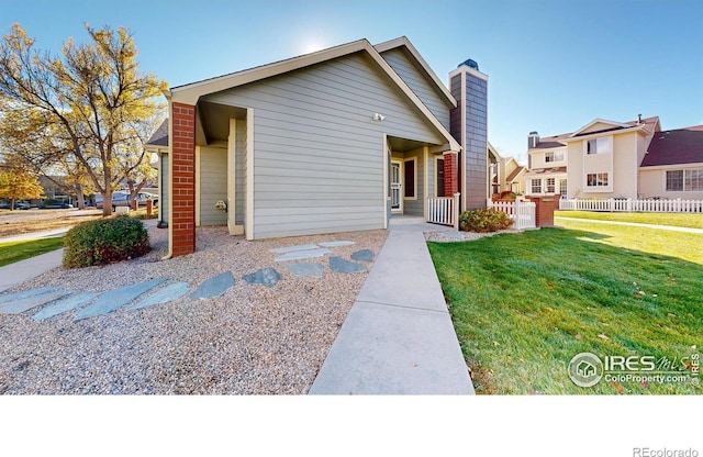 view of front of home with a front lawn