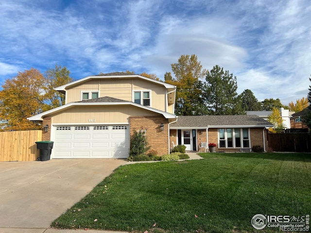 front of property featuring a garage and a front yard